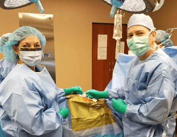 Dr. Andrew Will and Dr. Sherri Haas facing the camera as the implant the first Spectra WaveWriter spinal cord stimulator in Minnesota